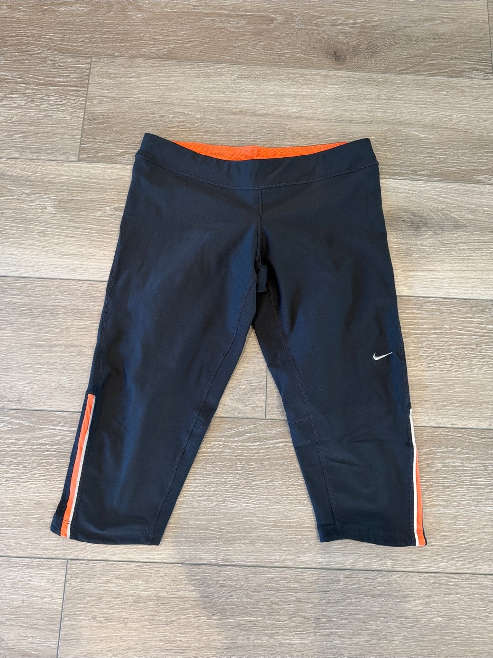 Nike Women Black Capri Leggings with Orange Trim and Swoosh